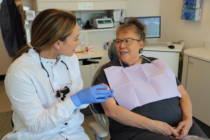 Dr. Montileaux reviews different partial denture options with the patient.