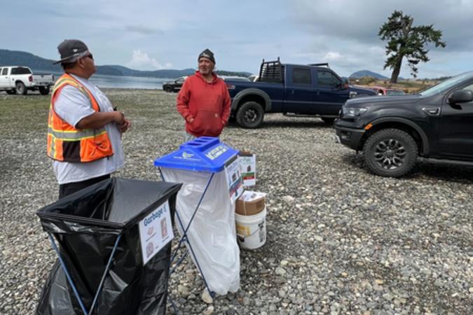 Forestry crew members man the recycling station at clam bake